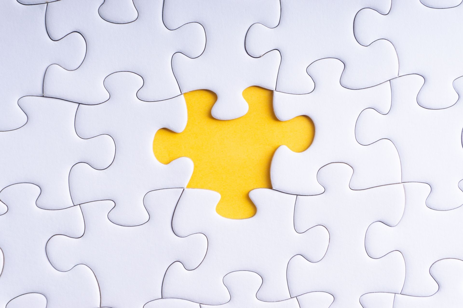 White jigsaw puzzle with selective focus and crop fragment